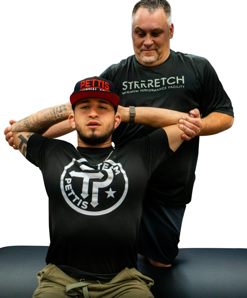 ASA instructor supporting a second client during assisted stretching